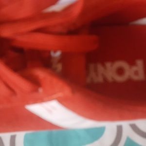 Size 6 1/2 red and white Pony's